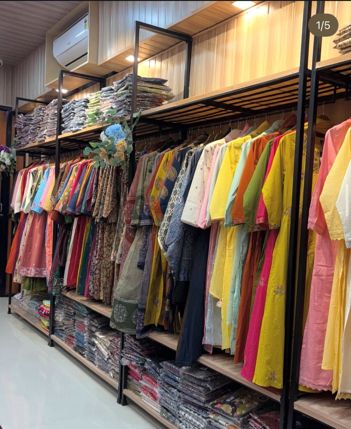 Racks of kurtis and suits inside the store
